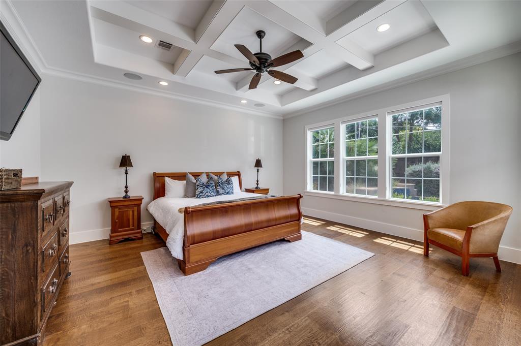 11240 Rosser Road Dallas, TX 75229 - Photo 11 of 18 a spacious bedroom with a bed and a couch