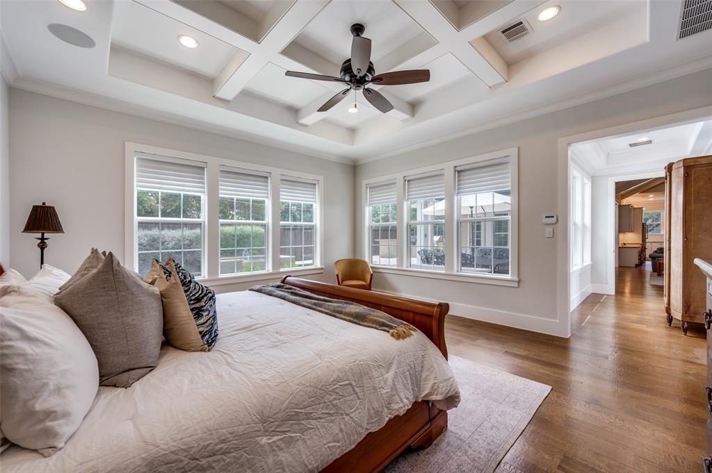 11240 Rosser Road Dallas, TX 75229 - Photo 12 of 18 a bedroom with a large bed and a large window