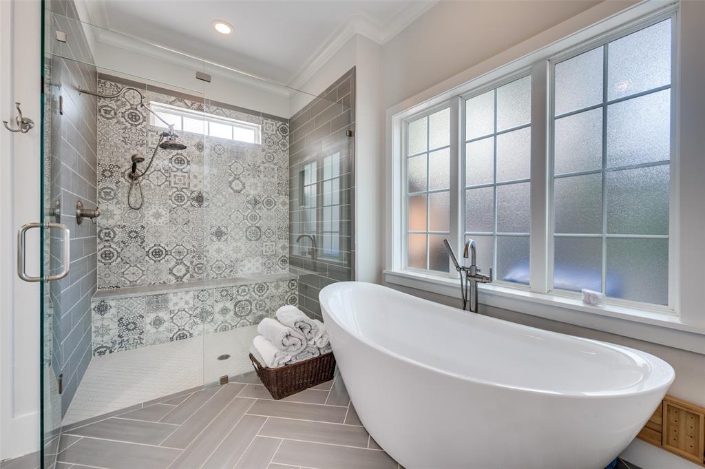 11240 Rosser Road Dallas, TX 75229 - Photo 13 of 18 a spacious bathroom with a tub and shower