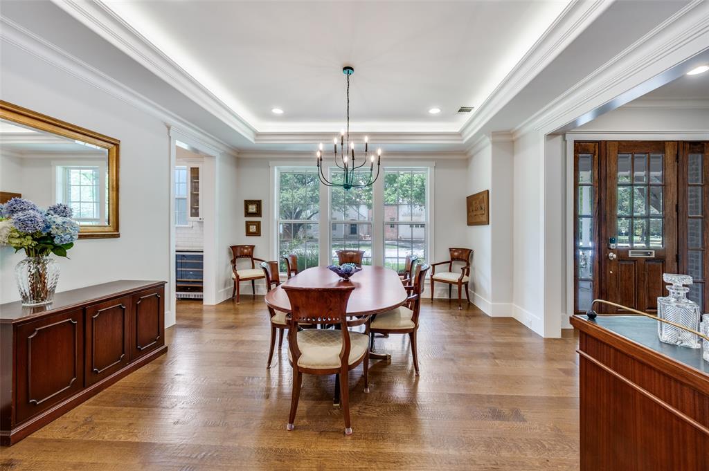 11240 Rosser Road Dallas, TX 75229 - Photo 9 of 18 a view of a dining room with furniture window and wooden floor