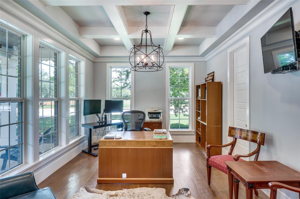 11240 Rosser Road Dallas, TX 75229 - Photo 10 of 18 a living room with furniture a chandelier and a fireplace