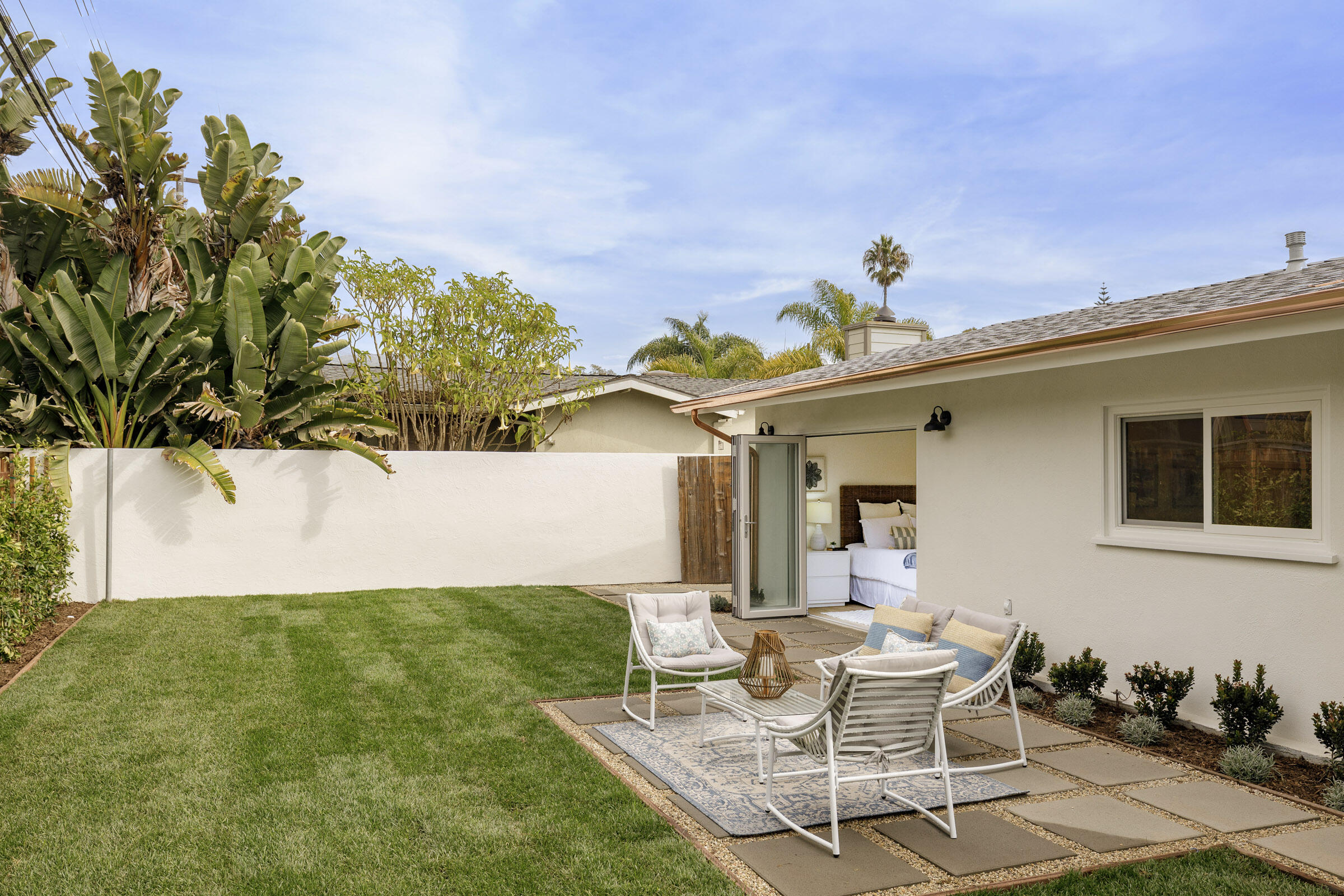 1377 Linhere Drive Carpinteria, CA 93013 - Photo 11 of 22 a view of a chair and table in backyard of the house