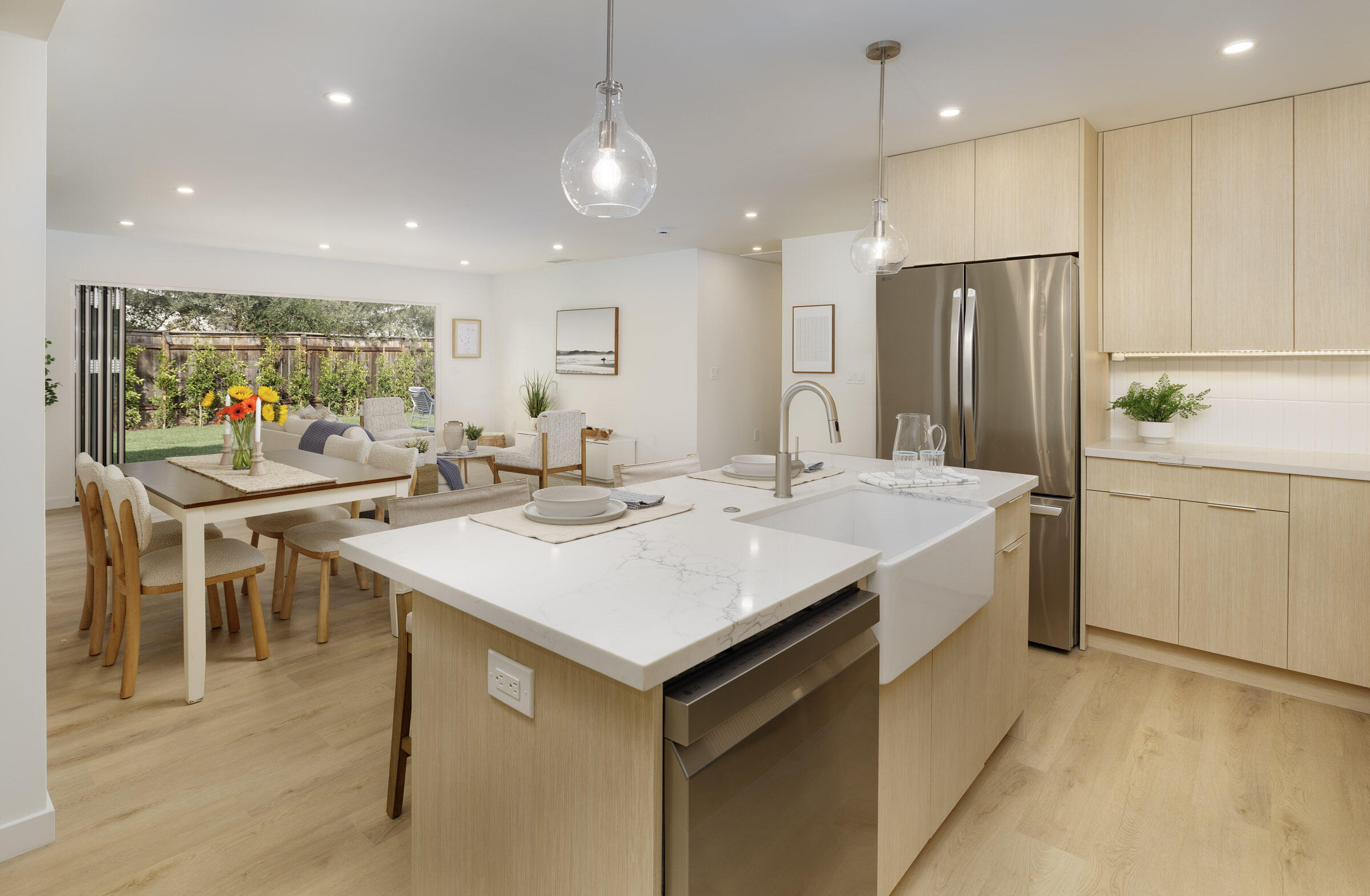 1377 Linhere Drive Carpinteria, CA 93013 - Photo 6 of 22 a large kitchen with kitchen island a sink a stove a dining table and chairs