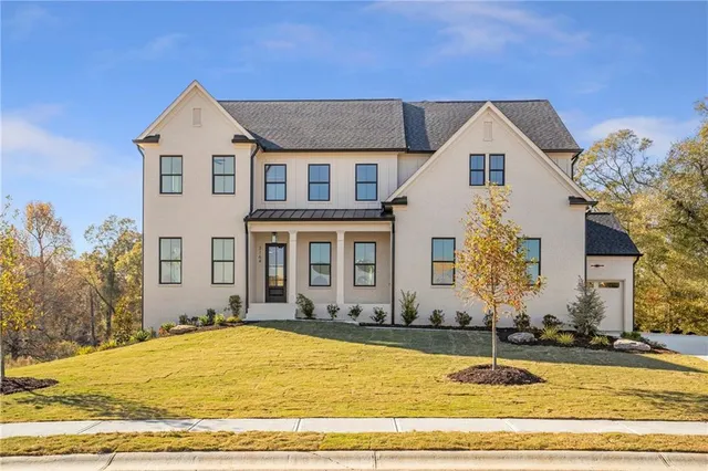 a front view of a house with a yard