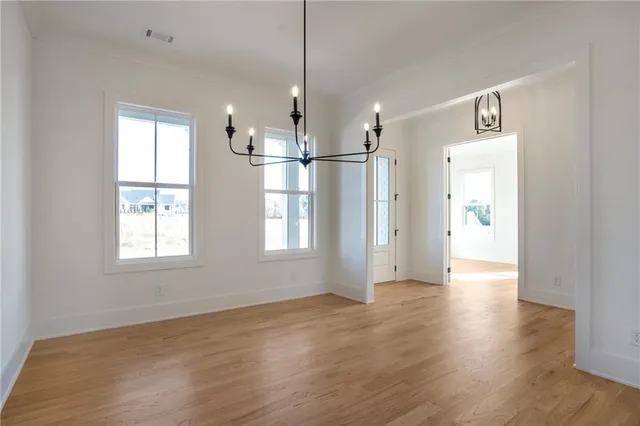 a kitchen with counter top space a sink stainless steel appliances and cabinets