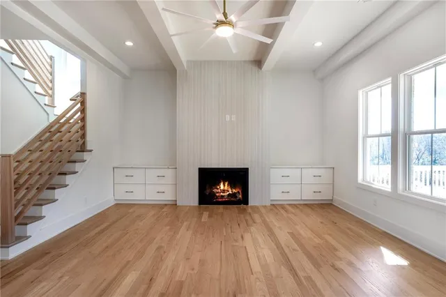 a view of kitchen and hall with wooden floor