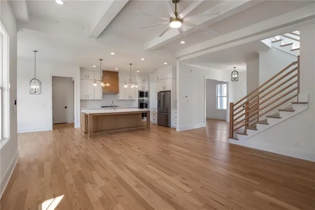 a bedroom with a large bed and a large window