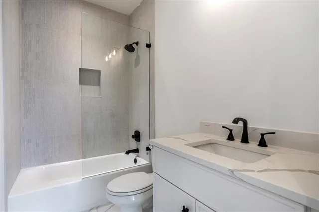 a view of a livingroom with a ceiling fan and window