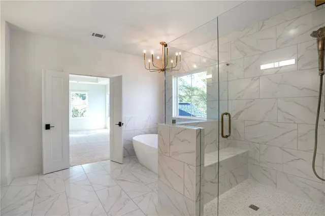 a view of empty room with floor to ceiling windows