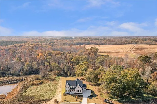 a view of hallway with wooden floor