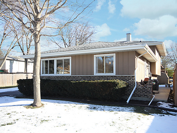 S031 Leonard Street Winfield, IL 60190 - Photo 2 of 25 a front view of a house with a yard