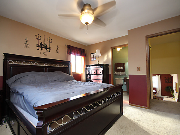 S031 Leonard Street Winfield, IL 60190 - Photo 13 of 25 a bedroom with a bed and a chandelier