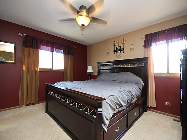 S031 Leonard Street Winfield, IL 60190 - Photo 14 of 25 a bed sitting in a bedroom next to a window