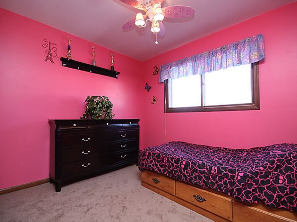 S031 Leonard Street Winfield, IL 60190 - Photo 17 of 25 a bedroom with a bed and a chandelier fan