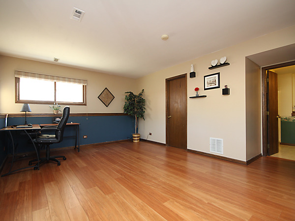 S031 Leonard Street Winfield, IL 60190 - Photo 19 of 25 a view of a workspace with furniture and a window