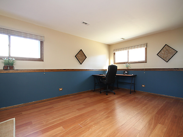 S031 Leonard Street Winfield, IL 60190 - Photo 20 of 25 a room with a piano and wooden floor