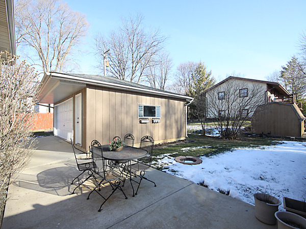 S031 Leonard Street Winfield, IL 60190 - Photo 22 of 25 a backyard of a house with table and chairs