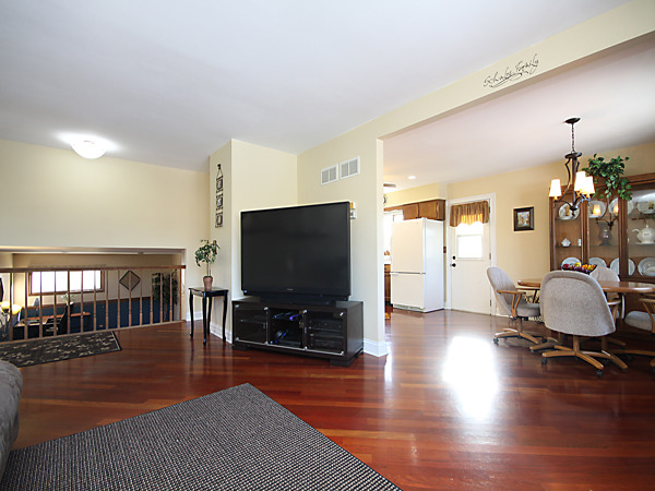 S031 Leonard Street Winfield, IL 60190 - Photo 6 of 25 a living room with furniture and a flat screen tv