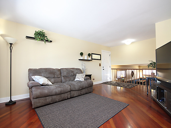 S031 Leonard Street Winfield, IL 60190 - Photo 7 of 25 a living room with furniture and a flat screen tv
