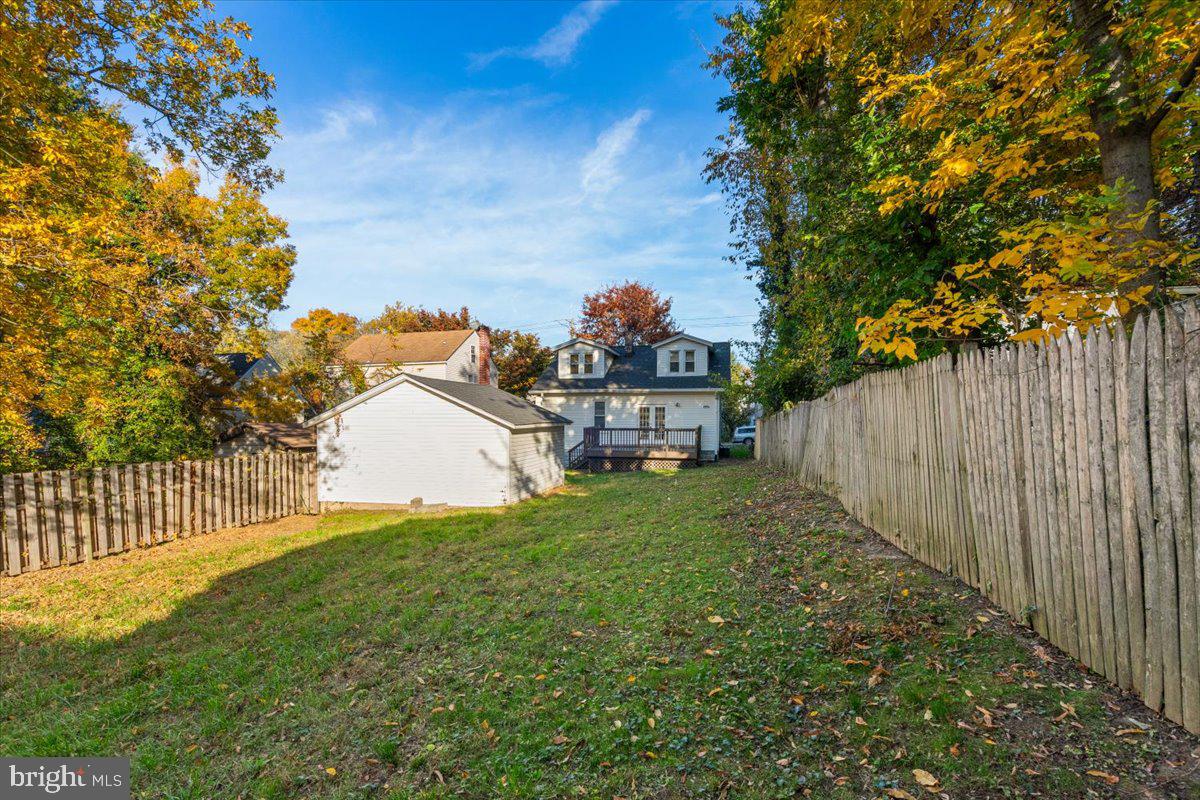 4302 30th Street Mount Rainier, MD 20712 - Photo 20 of 23 a view of a house with a small yard and a garden