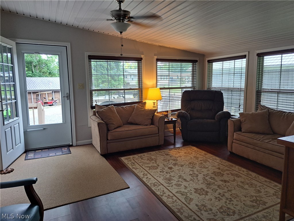 17875 Lashley Road, Unit 124 Senecaville, OH 43780 - Photo 14 of 45 Living room featuring lofted ceiling, ceiling fan, and hardwood / wood-style floors