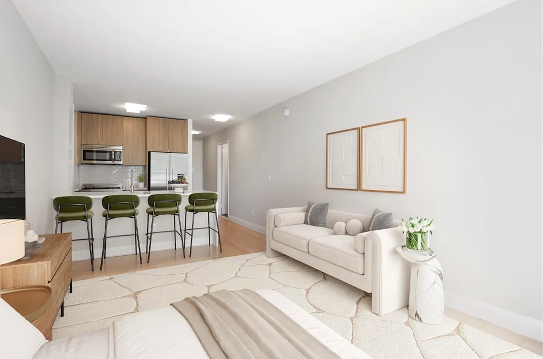 a living room with furniture and kitchen view