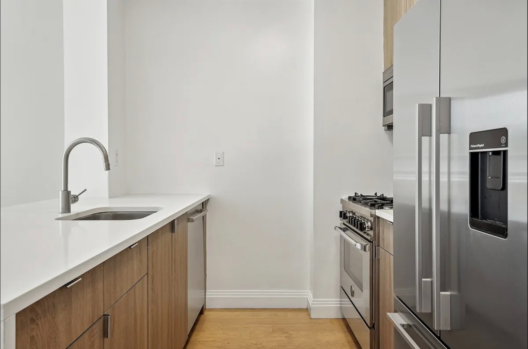 345 East 94th Street, Unit 6B Manhattan, NY 10128 - Photo 2 of 18 a close view of a sink storage and utility room