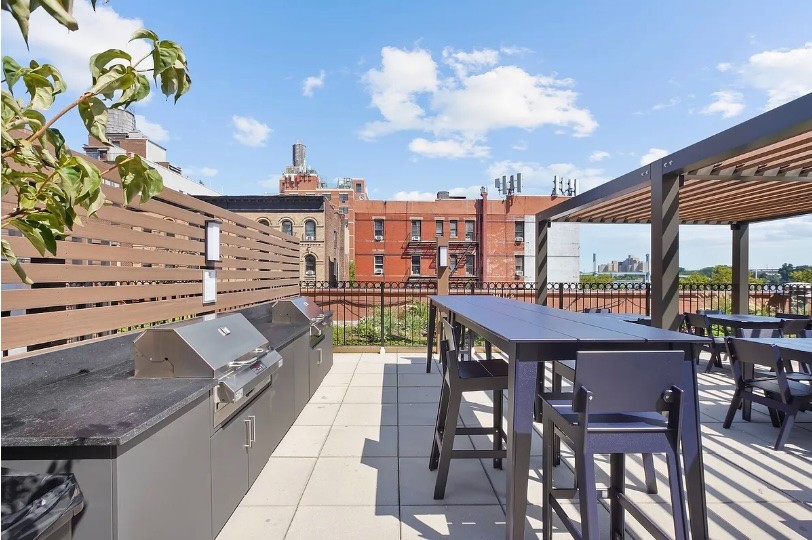 345 East 94th Street, Unit 6B Manhattan, NY 10128 - Photo 7 of 18 a view of a terrace with furniture and a table