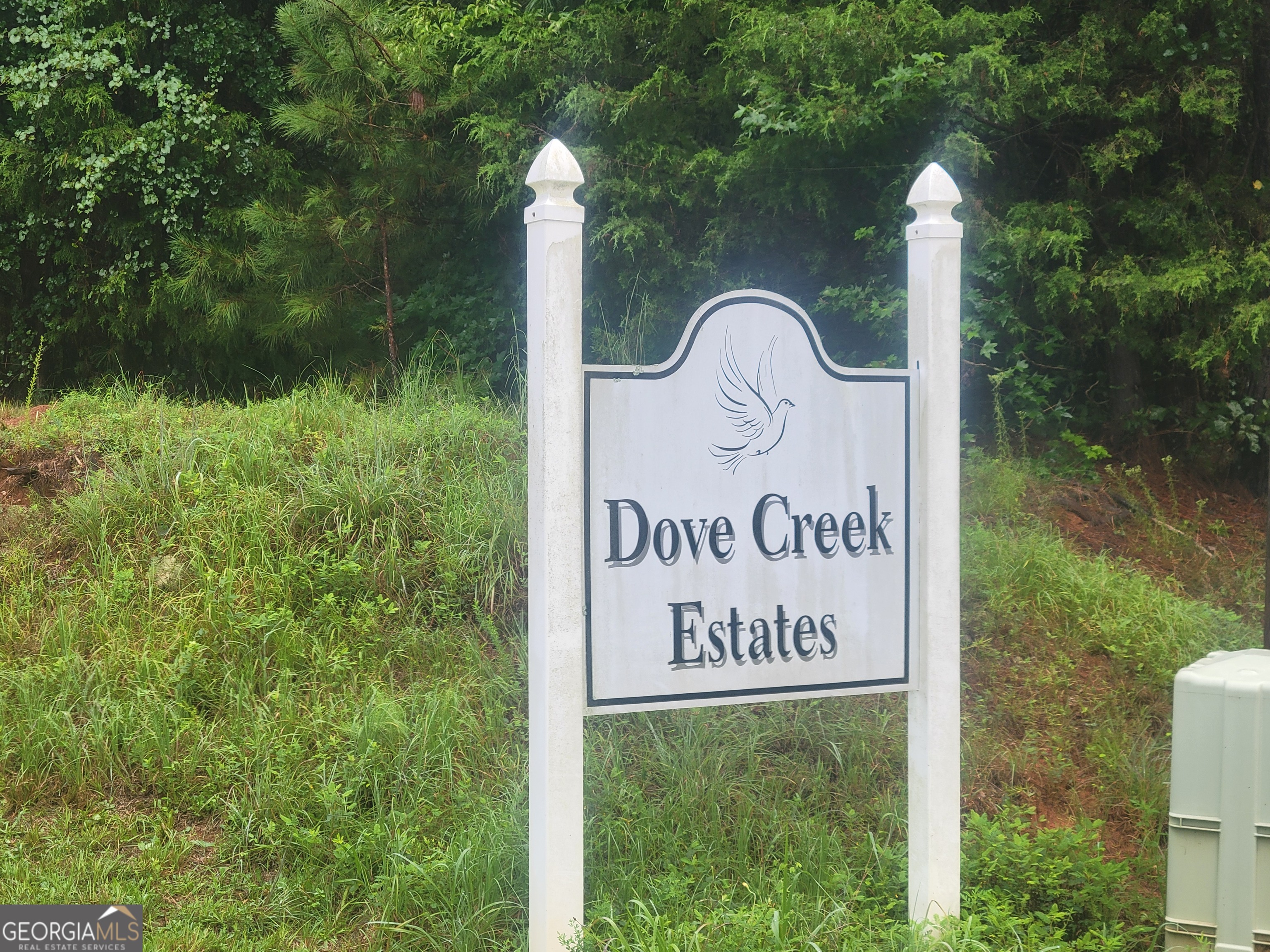 0 Stinchcomb Road, Unit 9 Elberton, GA 30635 - Photo 2 of 5 a sign board with a house and yard at the back