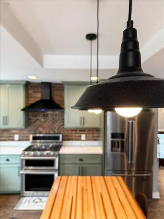 a living room with a fireplace and a flat screen tv