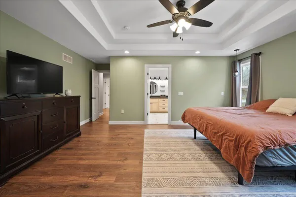 a bathroom with a sink a mirror and a shower