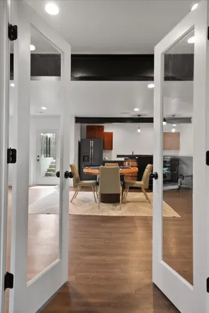 a black and white kitchen with granite countertop