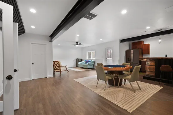 a kitchen with stainless steel appliances granite countertop a refrigerator and a stove