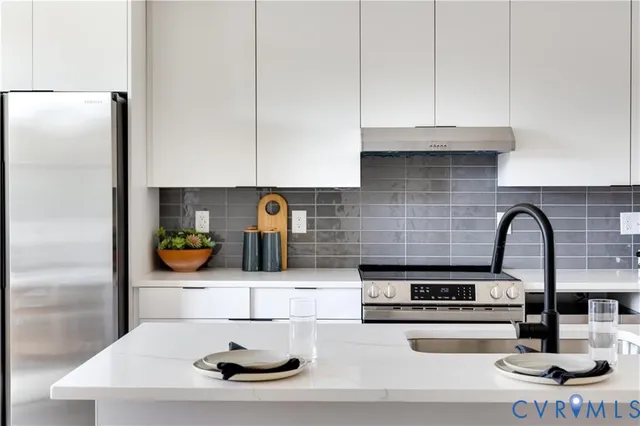 a kitchen with a sink and cabinets