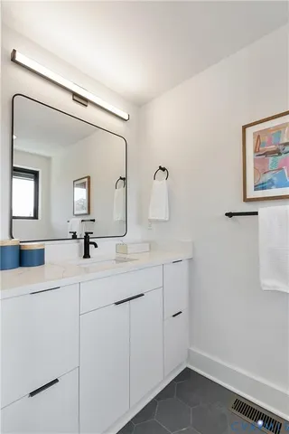 a bathroom with 2 sink and a mirror