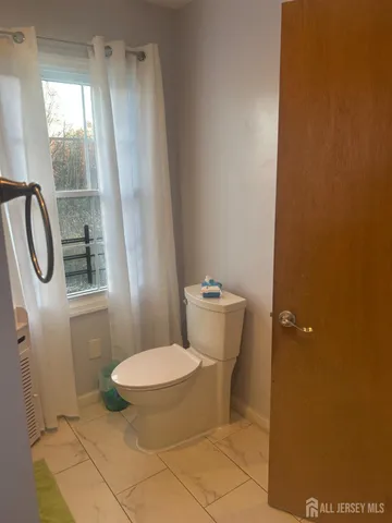 a bathroom with a toilet and a sink