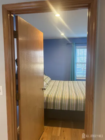 a bedroom with a bed and a table