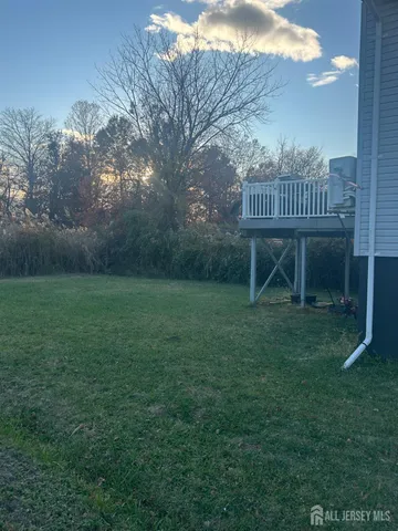 a view of a bench in the middle of a park