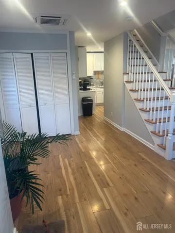 a view of a hallway to a house and a garage