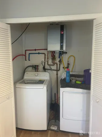 a utility room with dryer and washer