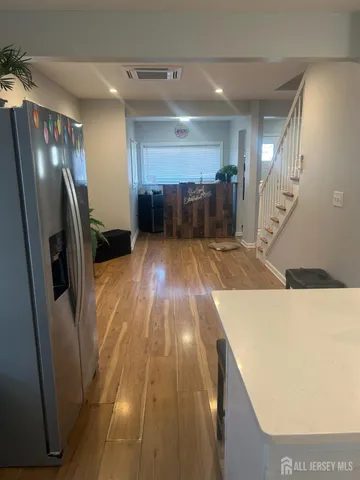 a view of kitchen with a refrigerator