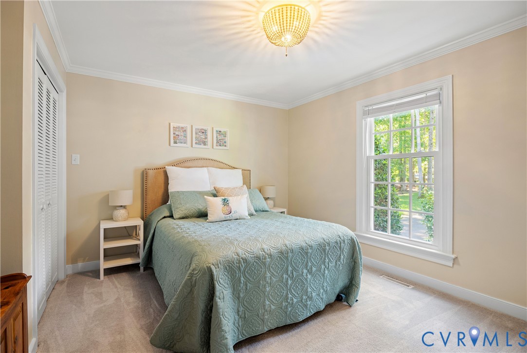 1911 Oakengate Lane Midlothian, VA 23113 - Photo 21 of 47 a bedroom with a bed and a window