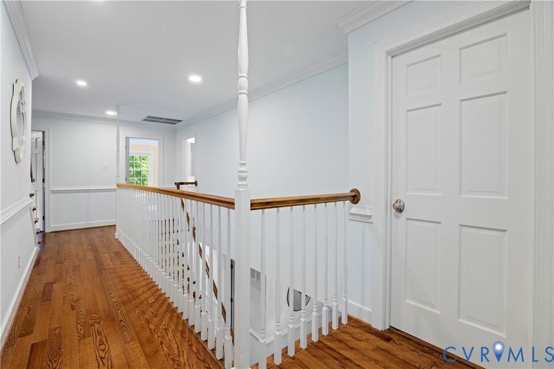 1911 Oakengate Lane Midlothian, VA 23113 - Photo 23 of 47 a view of a hallway with wooden floor and staircase