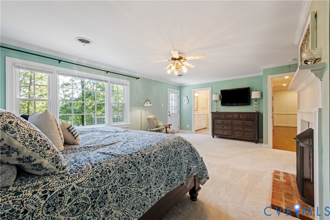 1911 Oakengate Lane Midlothian, VA 23113 - Photo 25 of 47 a spacious bedroom with a bed and a flat screen tv