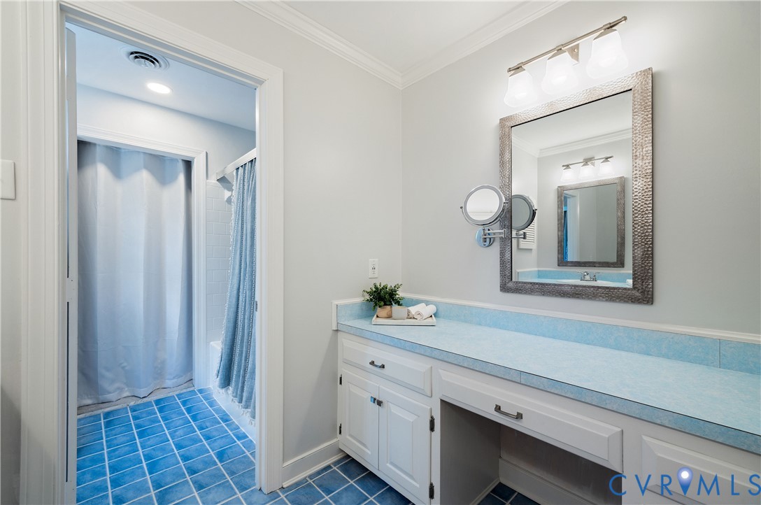 1911 Oakengate Lane Midlothian, VA 23113 - Photo 27 of 47 a bathroom with a sink and a mirror