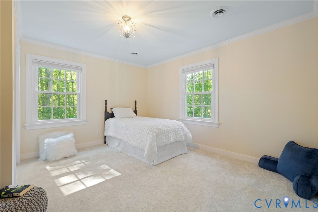 1911 Oakengate Lane Midlothian, VA 23113 - Photo 31 of 47 a bedroom with a bed and a window