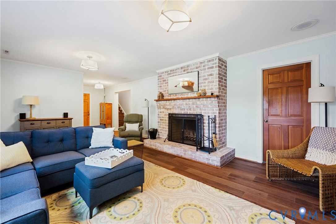 1911 Oakengate Lane Midlothian, VA 23113 - Photo 35 of 47 a living room with furniture a rug and a fireplace
