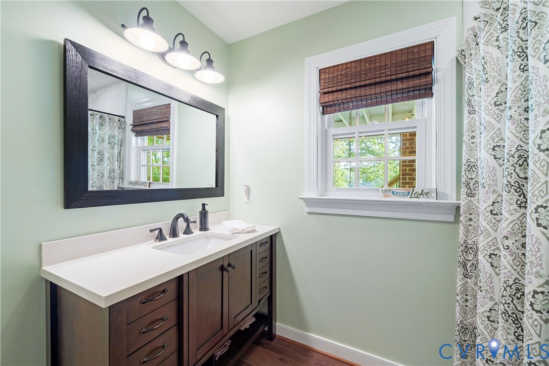 1911 Oakengate Lane Midlothian, VA 23113 - Photo 37 of 47 a bathroom with a sink and a mirror