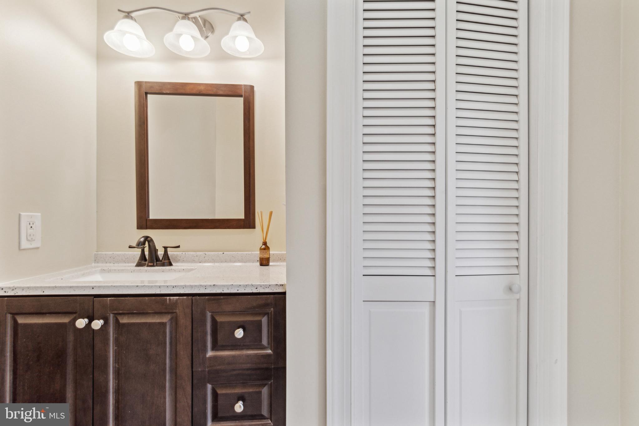 911 Regester Avenue Baltimore, MD 21239 - Photo 16 of 40 Main level half bath