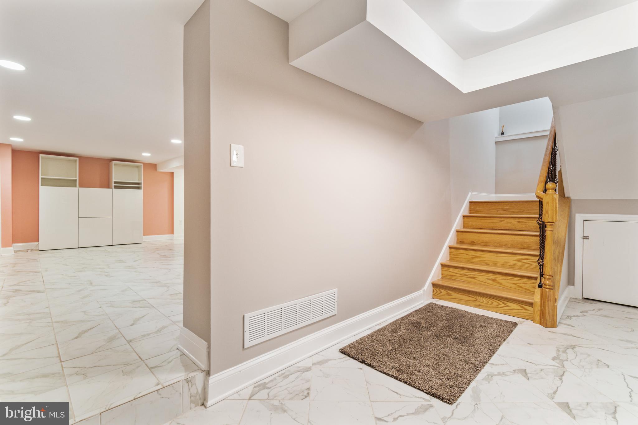 911 Regester Avenue Baltimore, MD 21239 - Photo 28 of 40 View of stairs to basement